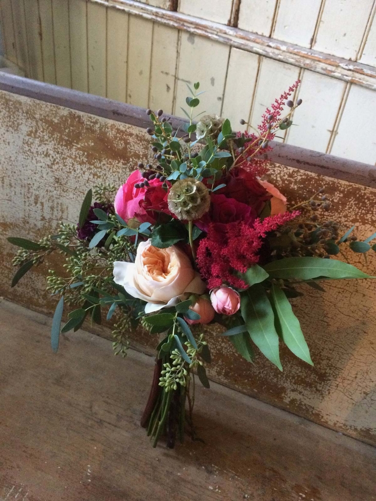 bouquet leaning on weathered wood