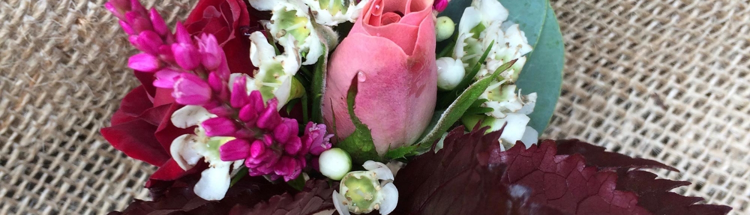 bright corsage on burlap