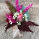 bright corsage on burlap
