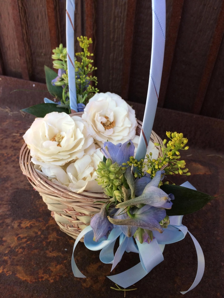 basket with ribbons and roses